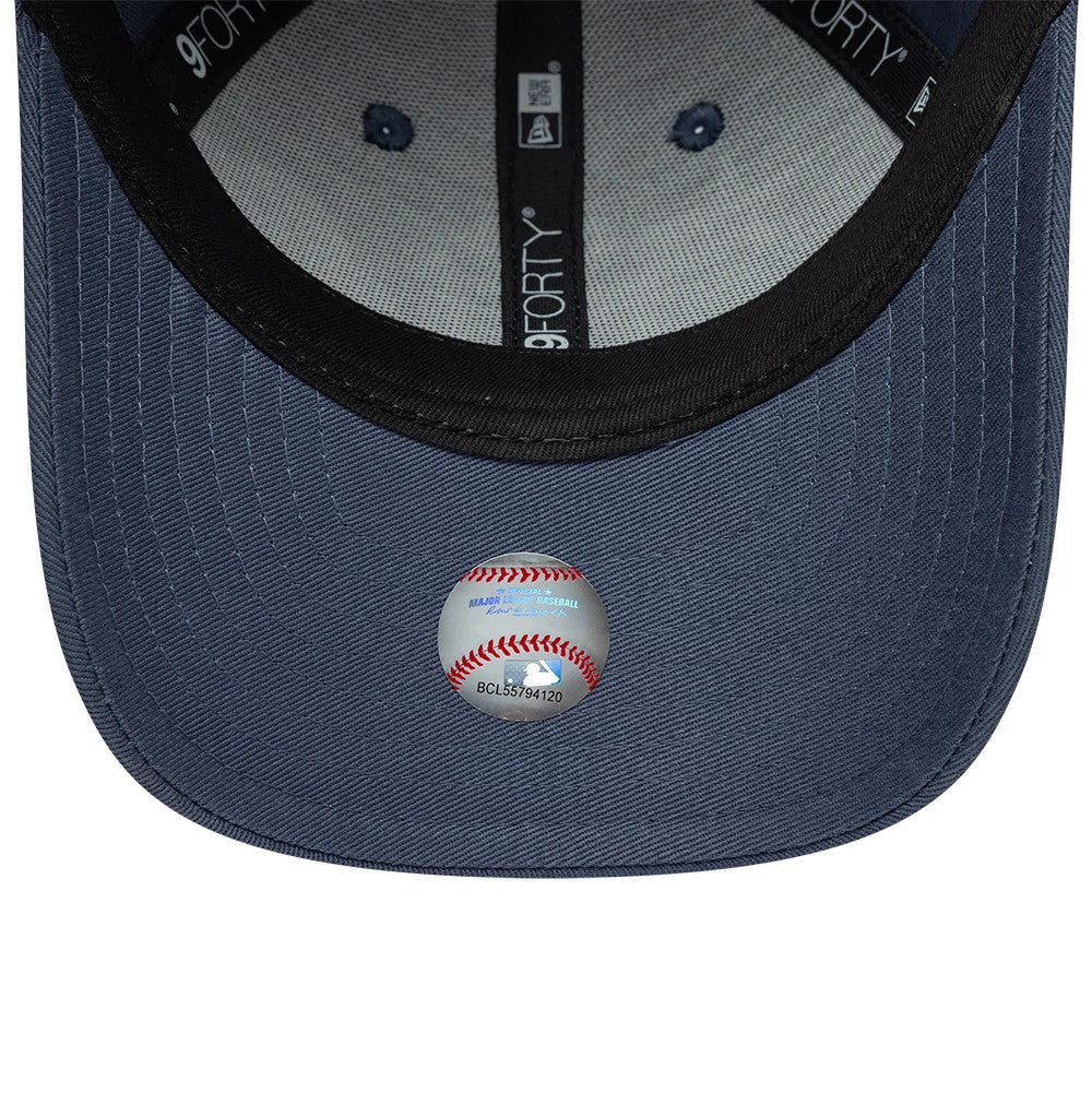 Yankees Child MLB Space Glow In The Dark Blue New Era 9FORTY Adjustable Cap, inside view showing the black sweatband with 9FORTY branding, grey taping along the crown seams, navy undervisor, and a printed sticker featuring a baseball design.