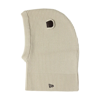 Child New Era Bear Light Beige Balaclava Hat, side view showing the ribbed knit texture in light beige, with a distinctive bear-shaped ear detail on top and the New Era flag logo embroidered in black on the lower edge.