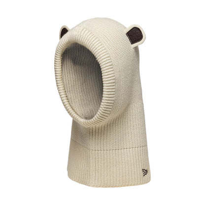 Child New Era Bear Light Beige Balaclava Hat, three-quarter view showing knit fabrication with cute bear ears on top, a wide ribbed opening for the face, and a small embroidered New Era flag logo near the bottom edge.