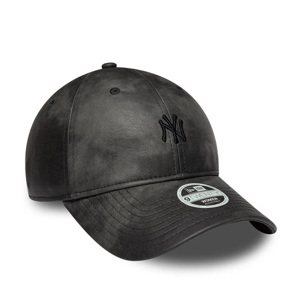 New York Yankees Womens MLB Washed PU Black New Era 9TWENTY Adjustable Cap, three-quarter view showing the black embroidered NY logo on the front panel, a curved visor with a 9TWENTY size sticker, and a washed black finish on the structured crown.