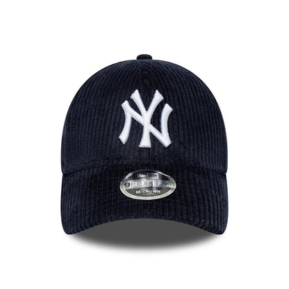 New York Yankees Youth MLB Cord Navy New Era 9FORTY M-Crown Adjustable Cap, front view showing a prominent white NY logo in raised embroidery on the structured corduroy crown, with the curved visor featuring a 9FORTY size sticker.