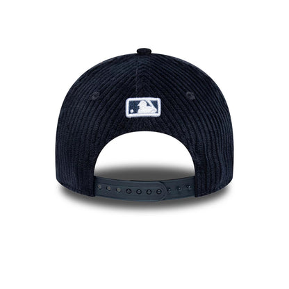 New York Yankees Youth MLB Cord Navy New Era 9FORTY M-Crown Adjustable Cap, rear view showing the white embroidered MLB Batterman logo centred on the textured navy corduroy fabric, with a black adjustable strap for a custom fit.