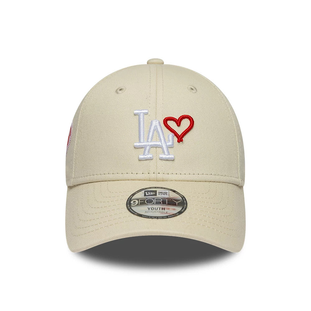 Pictured is this Youth MLB Heart Icon LA Dodgers 9FORTY cap in light beige. 2