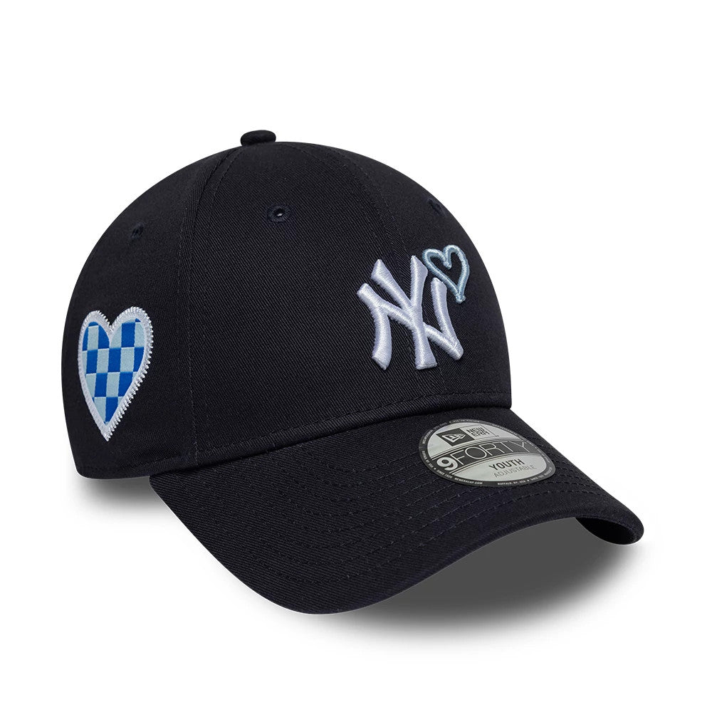 New York Yankees Youth MLB Heart Icon Navy New Era 9FORTY Adjustable Cap, front view showing the raised white NY logo with a light blue heart outline, checkered blue and white heart patch on the side, and 9FORTY size sticker on the visor.