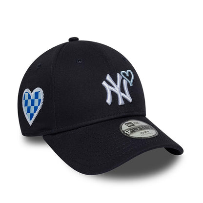 New York Yankees Youth MLB Heart Icon Navy New Era 9FORTY Adjustable Cap, front view showing the raised white NY logo with a light blue heart outline, checkered blue and white heart patch on the side, and 9FORTY size sticker on the visor.