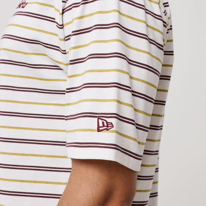 The model is wearing this New Era Stripe T-Shirt in white. 7
