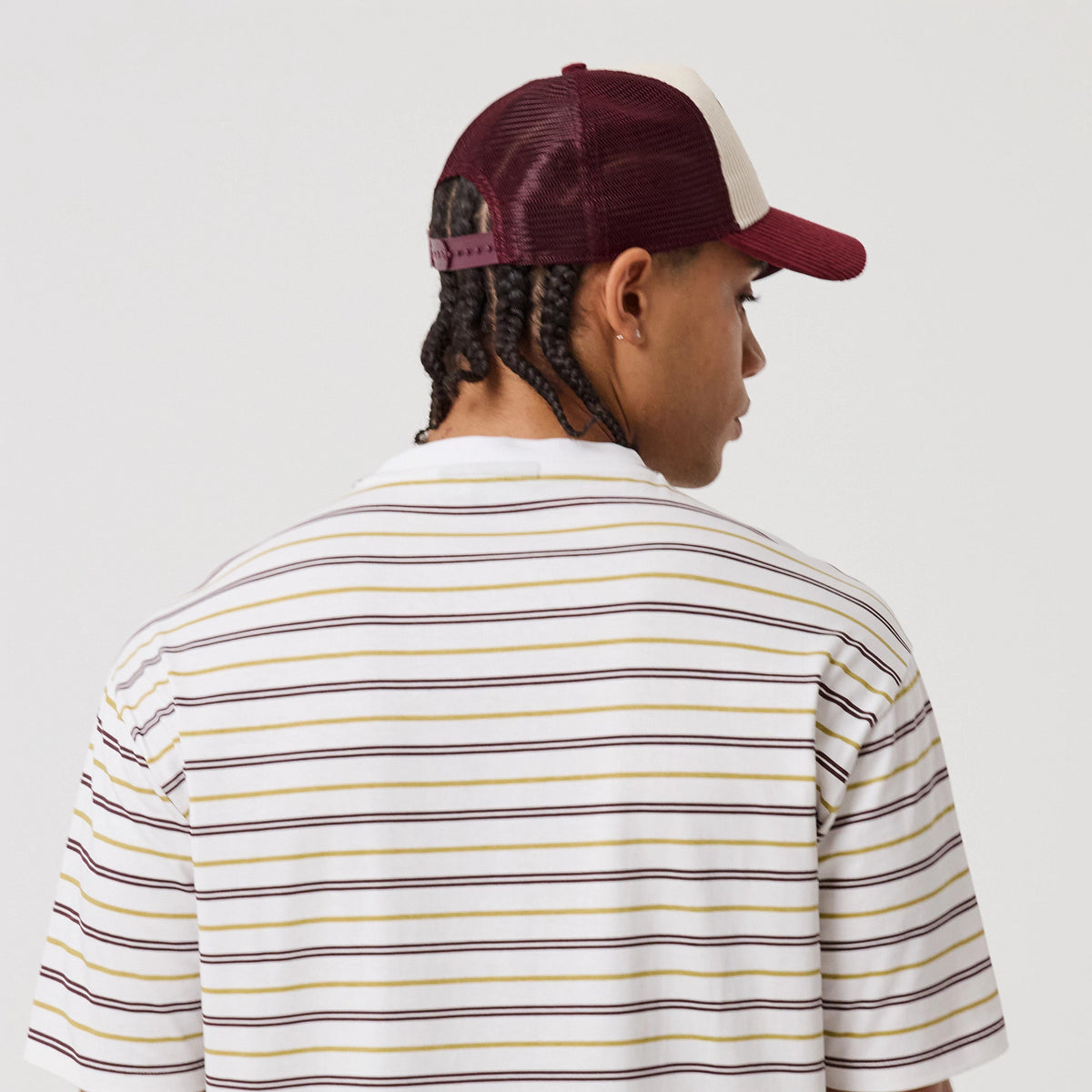 The model is wearing this New Era Stripe T-Shirt in white. 8