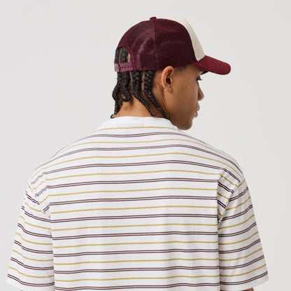 The model is wearing this New Era Stripe T-Shirt in white. 8