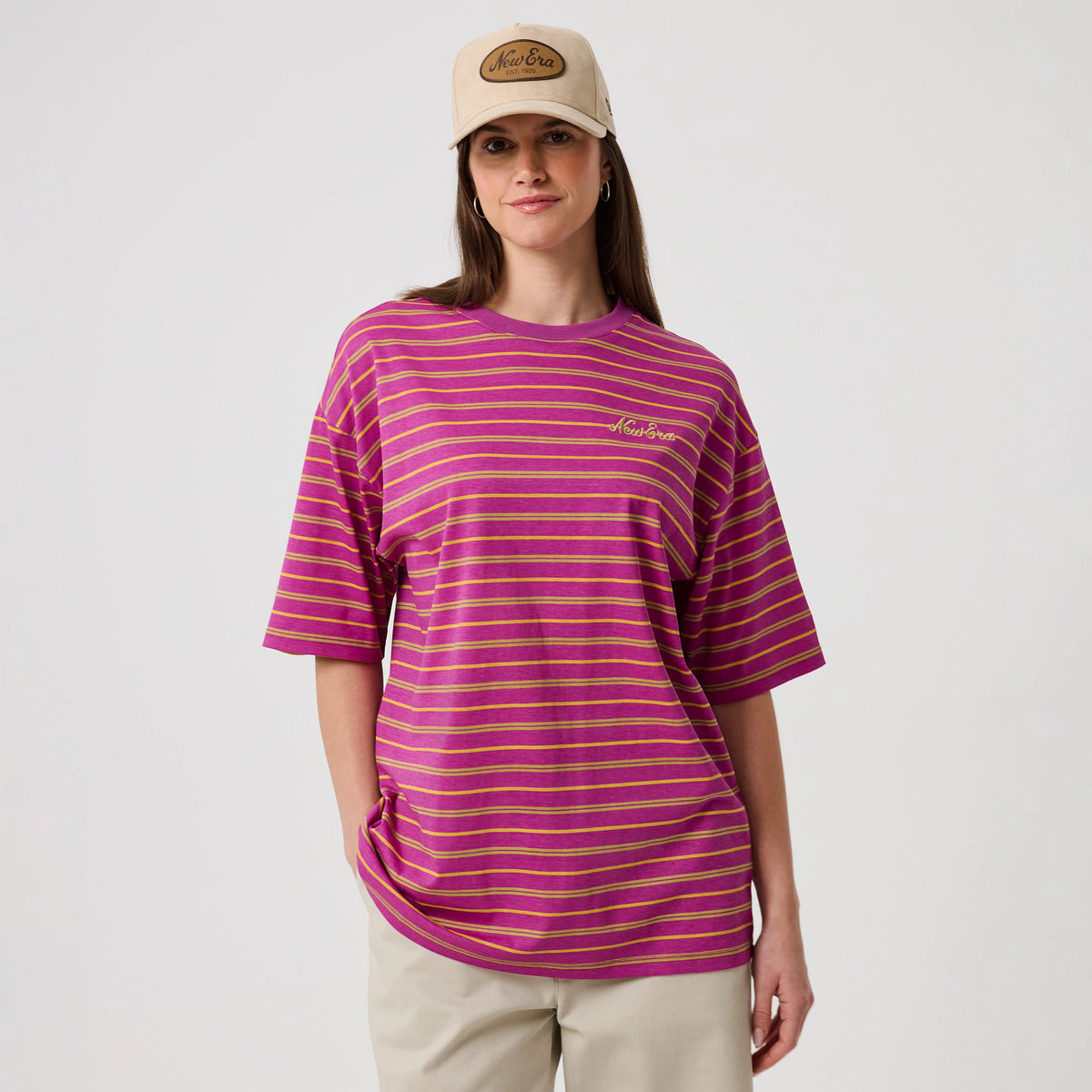 The model is wearing this New Era Stripe T-Shirt in bright purple. 4