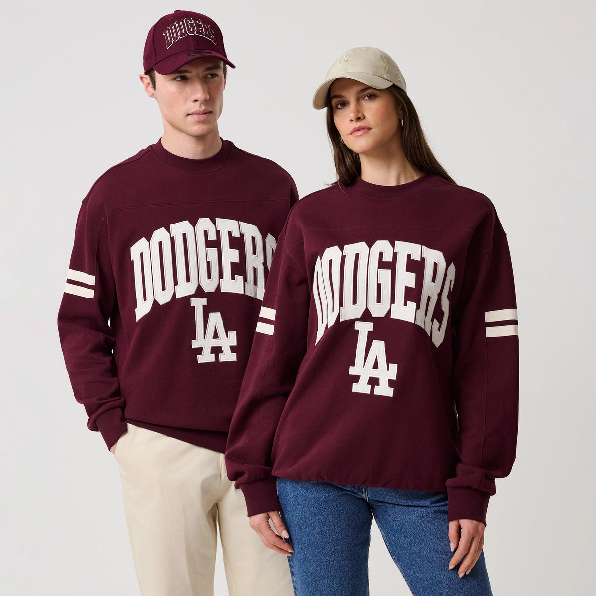 The model is wearing this MLB Arch Graphic LA Dodgers Crew Neck Sweater in dark purple. 1