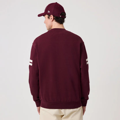 The model is wearing this MLB Arch Graphic LA Dodgers Crew Neck Sweater in dark purple. 2
