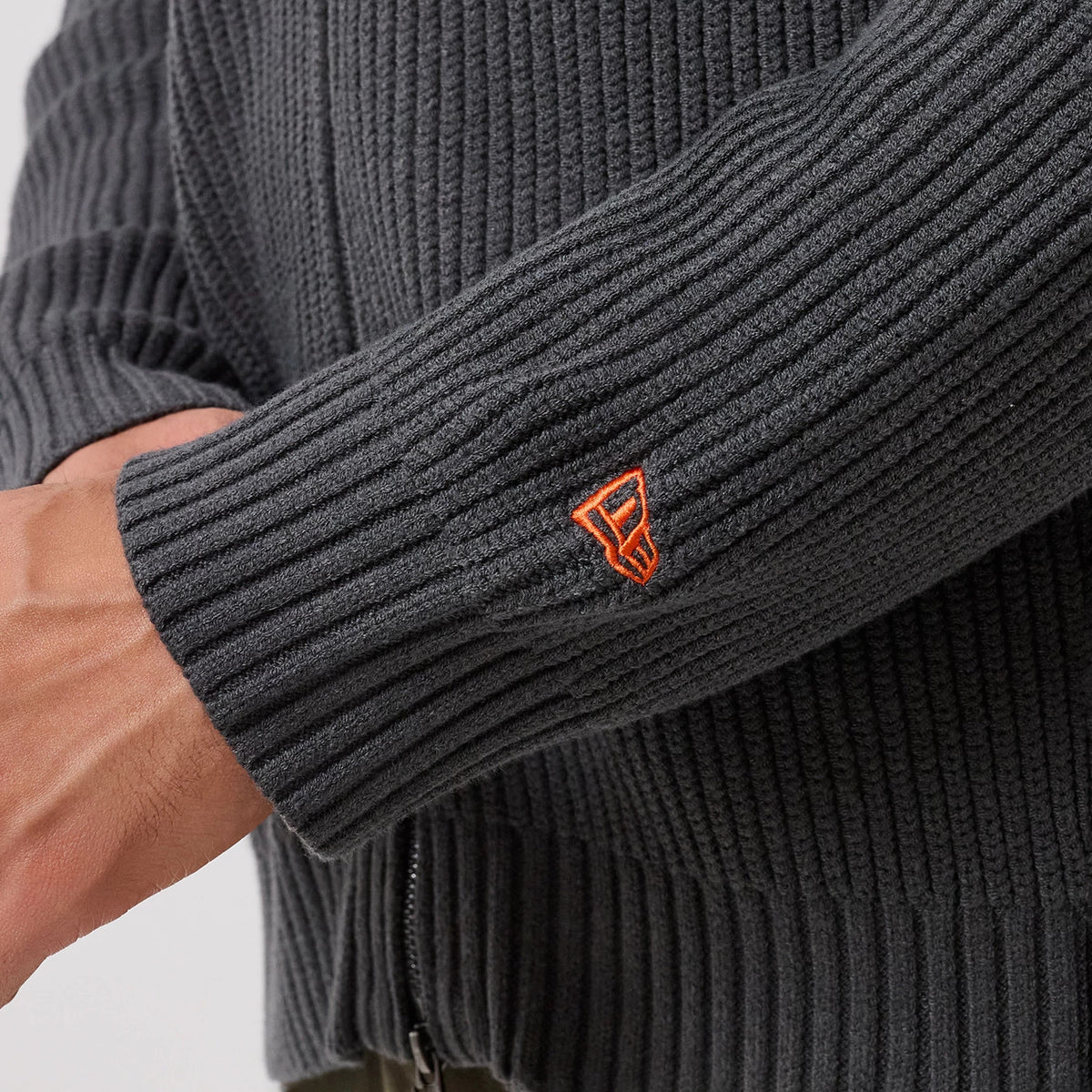 The model is wearing this MLB New York Mets 2 Way Zip Cardigan in charcoal. 7