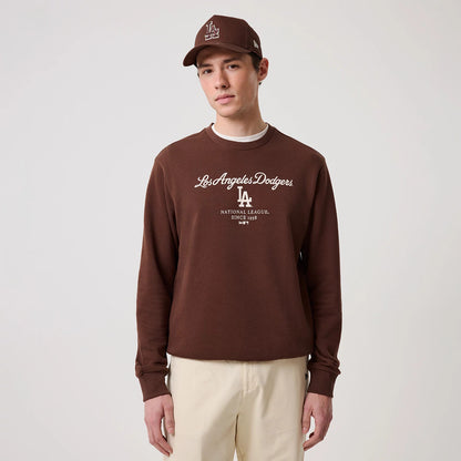 The model is wearing this MLB Linear LA Dodgers Crew Neck Sweater in brown. 3
