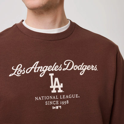 The model is wearing this MLB Linear LA Dodgers Crew Neck Sweater in brown. 5