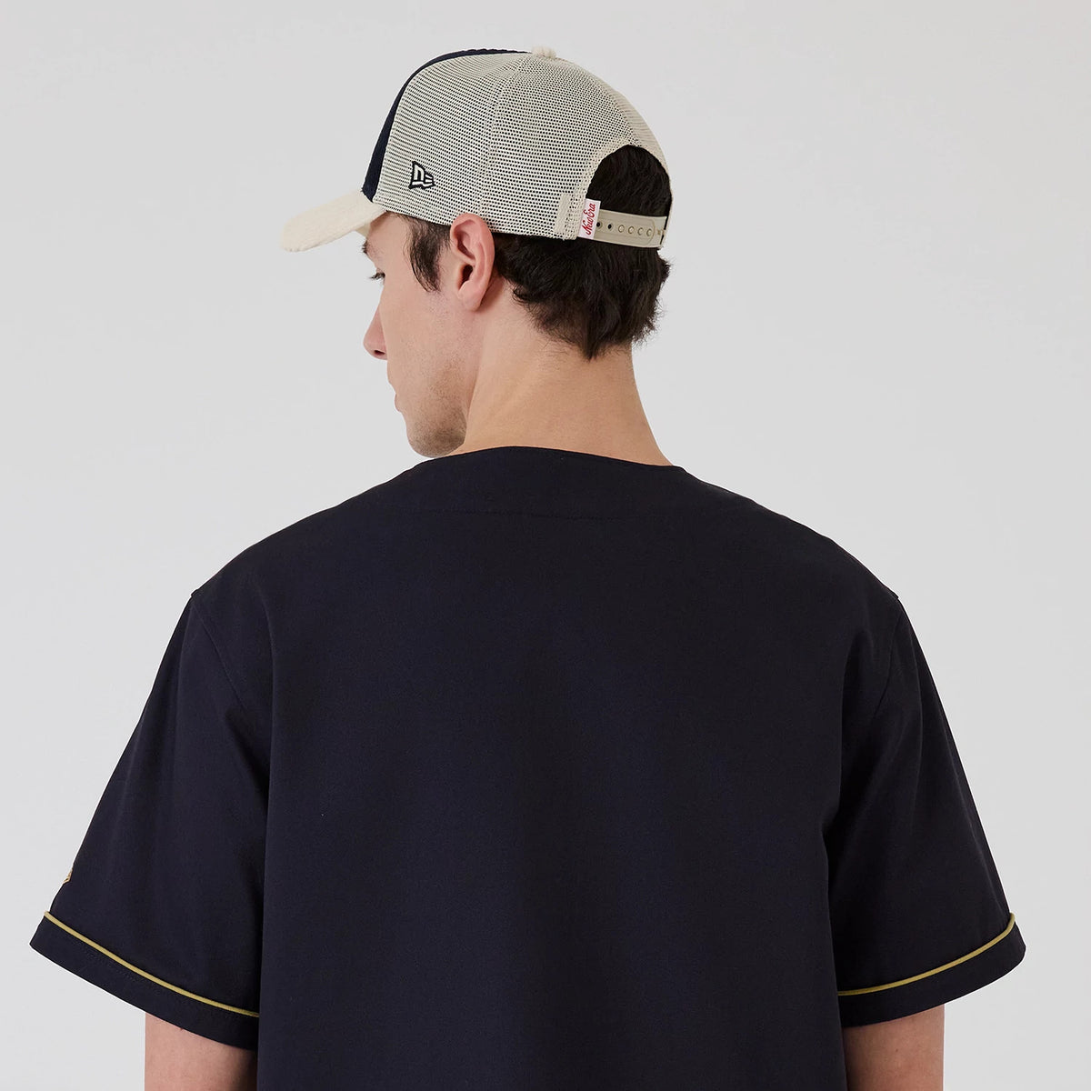 The model is wearing this New Era Straight Hem Jersey in navy. 7