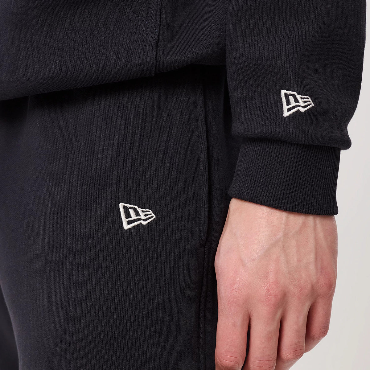 The model is wearing this New Era Straight Leg Joggers in navy. 4