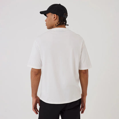 The model is wearing this MLB Hotdog Graphic New York Yankees Oversized T-Shirt in white. 2