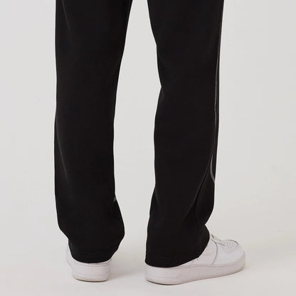 The model is wearing this NBA Graphic Chicago Bulls Straight Leg Joggers in black. 7