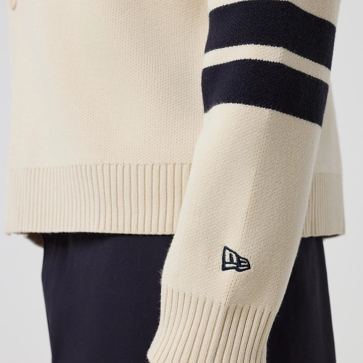 The model is wearing this MLB Knit New York Yankees Cardigan in light beige. 7