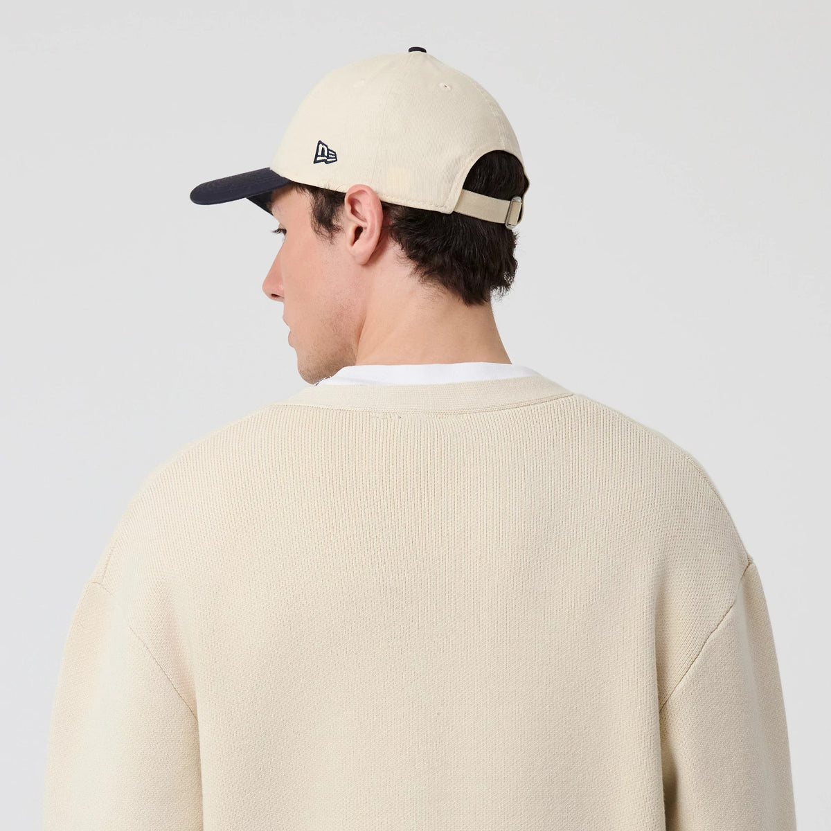 The model is wearing this MLB Knit New York Yankees Cardigan in light beige. 8