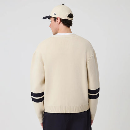 The model is wearing this MLB Knit New York Yankees Cardigan in light beige. 2
