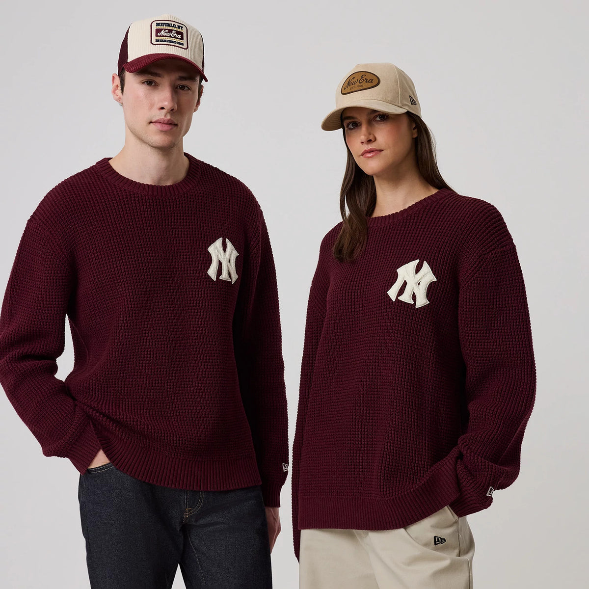 The model is wearing this MLB Waffle Knit New York Yankees Crew Neck Sweater in dark purple. 1