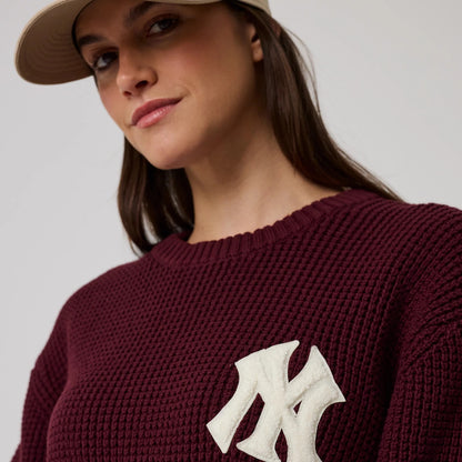 The model is wearing this MLB Waffle Knit New York Yankees Crew Neck Sweater in dark purple. 6