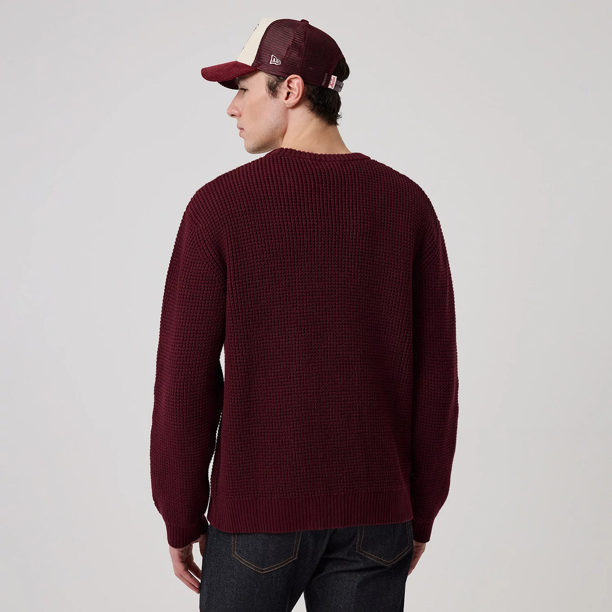 The model is wearing this MLB Waffle Knit New York Yankees Crew Neck Sweater in dark purple. 2
