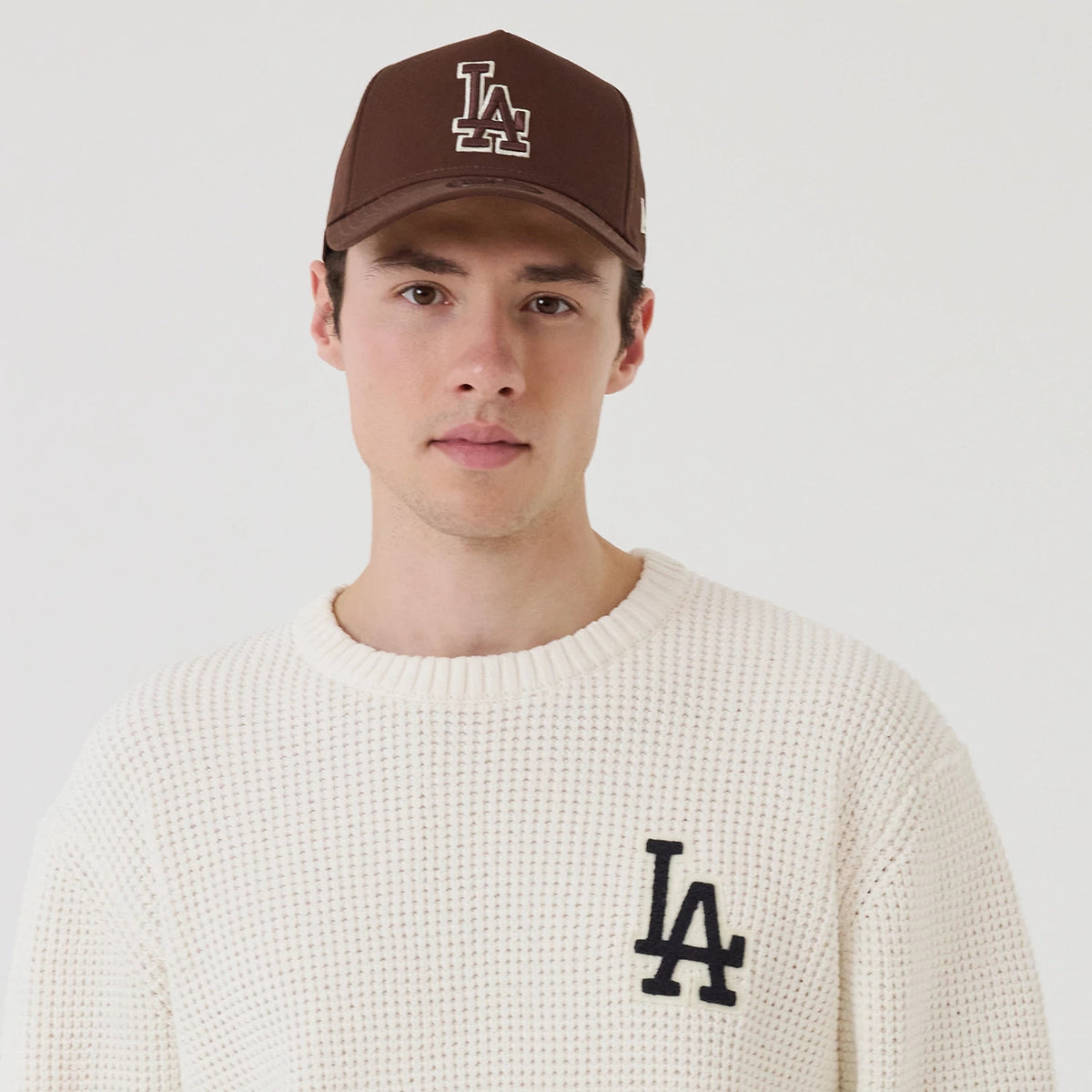 The model is wearing this MLB Waffle Knit LA Dodgers Crew Neck Sweater in open white. 6