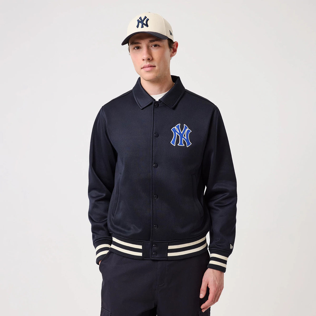 The model is wearing this MLB New York Yankees Collared Jacket in navy. 3