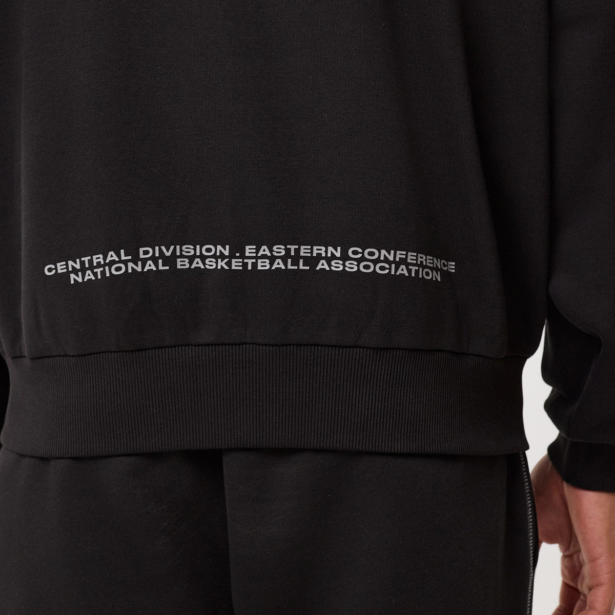 The model is wearing this NBA Graphic Chicago Bulls Pullover Hoodie in black. 8