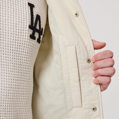 The model is wearing this MLB LA Dodgers Coach Jacket in light beige. 6