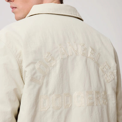 The model is wearing this MLB LA Dodgers Coach Jacket in light beige. 8