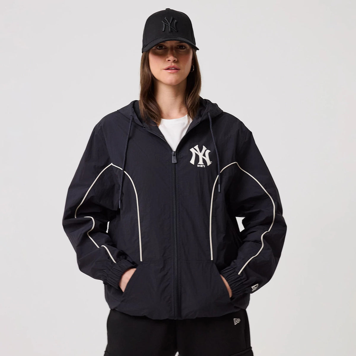 The model is wearing this MLB Piping New York Yankees Track Jacket in navy. 4