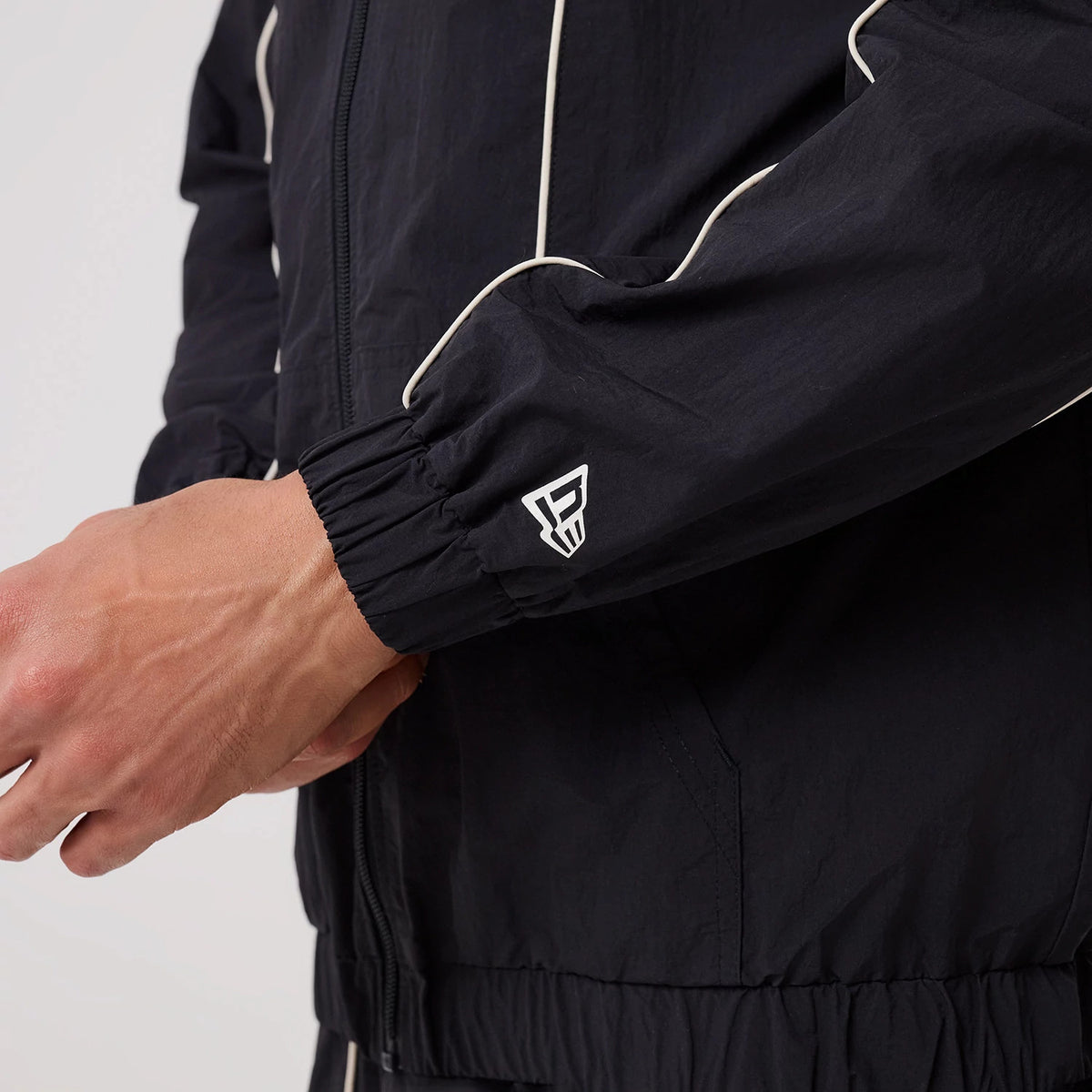 The model is wearing this MLB Piping New York Yankees Track Jacket in navy. 6