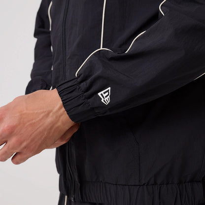The model is wearing this MLB Piping New York Yankees Track Jacket in navy. 6