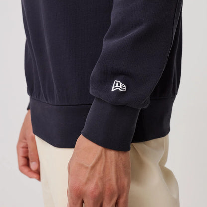 The model is wearing this MLB Arch Graphic New York Yankees Crew Neck Sweater in navy. 7