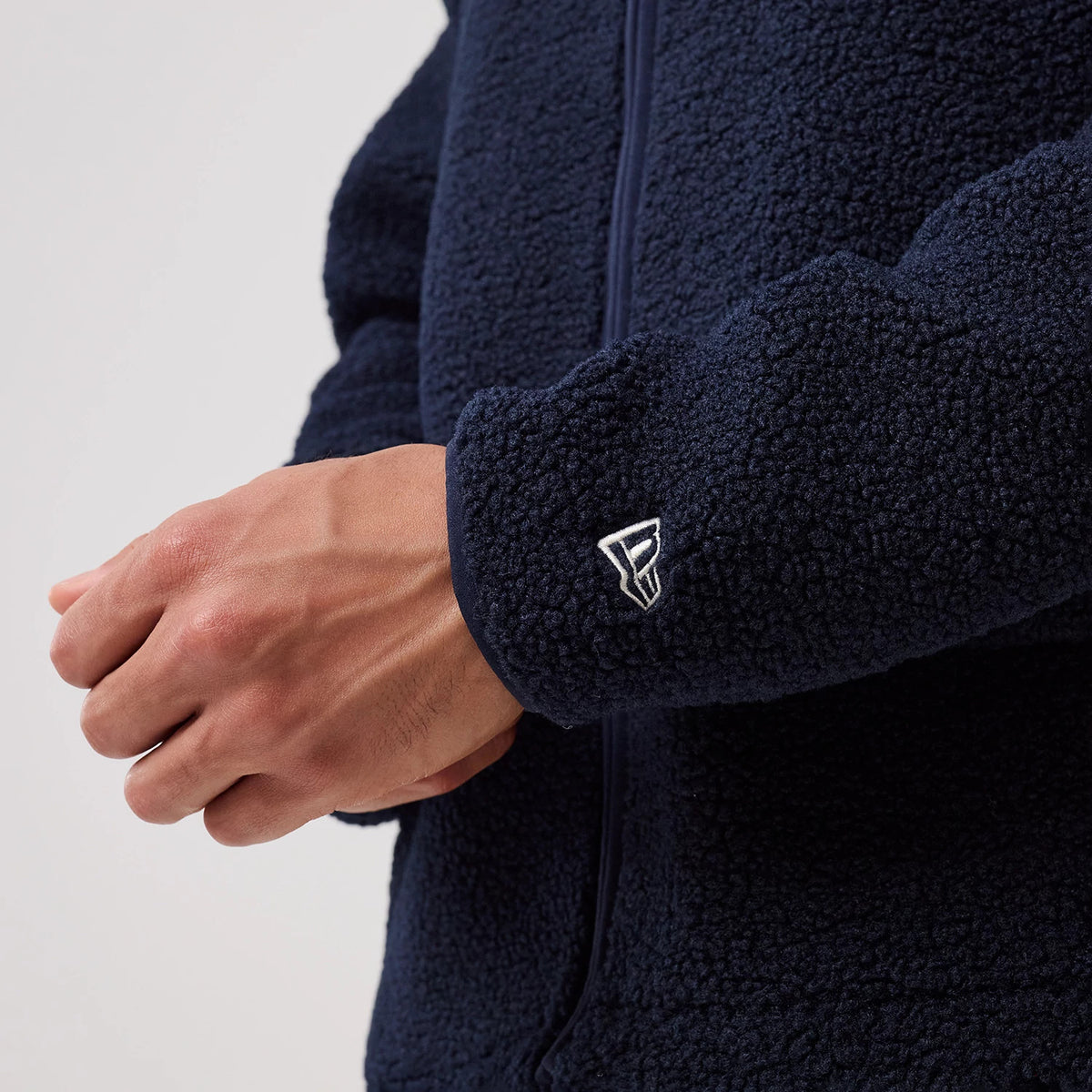 The model is wearing this MLB New York Yankees Sherpa Jacket in dark blue. 7