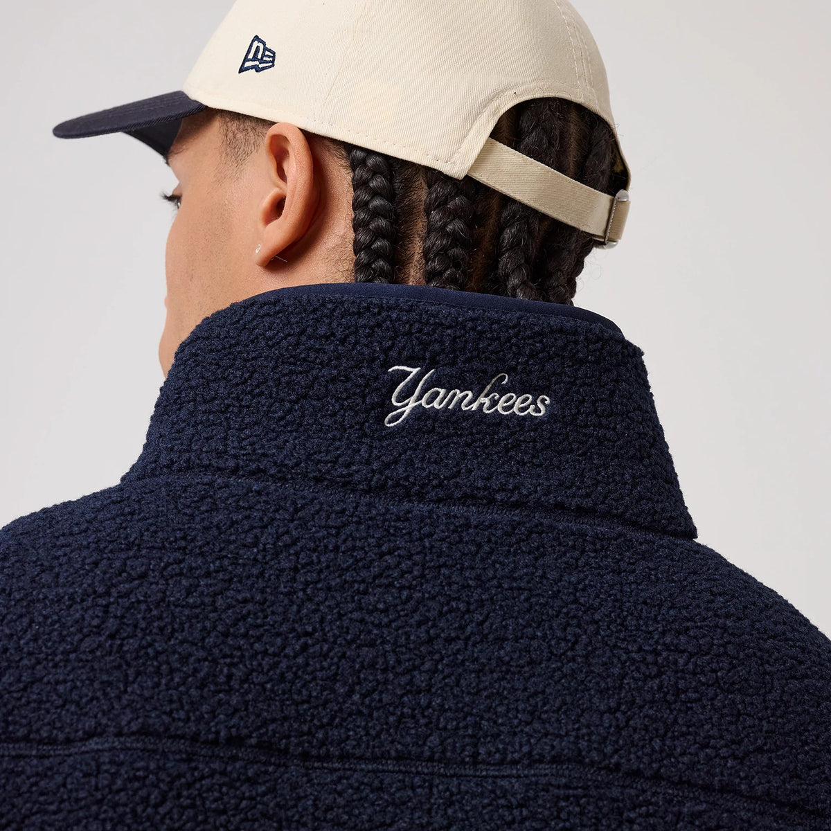 The model is wearing this MLB New York Yankees Sherpa Jacket in dark blue. 8