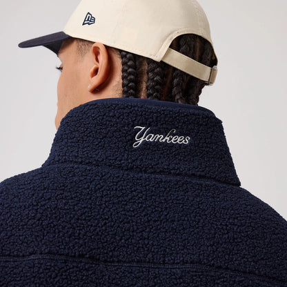 The model is wearing this MLB New York Yankees Sherpa Jacket in dark blue. 8