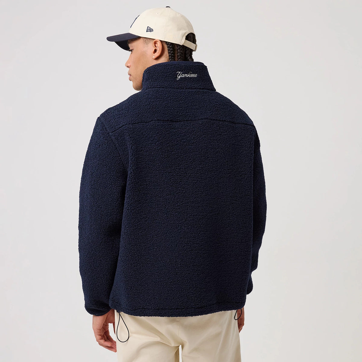 The model is wearing this MLB New York Yankees Sherpa Jacket in dark blue. 2