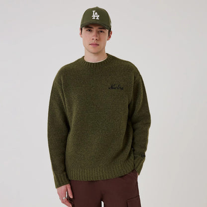 The model is wearing this New Era Simple Knit Knitted Sweater in green. 1