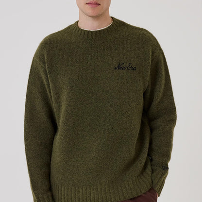 The model is wearing this New Era Simple Knit Knitted Sweater in green. 3