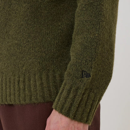 The model is wearing this New Era Simple Knit Knitted Sweater in green. 6