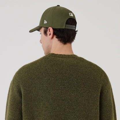 The model is wearing this New Era Simple Knit Knitted Sweater in green. 4