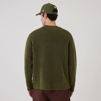 The model is wearing this New Era Simple Knit Knitted Sweater in green. 2