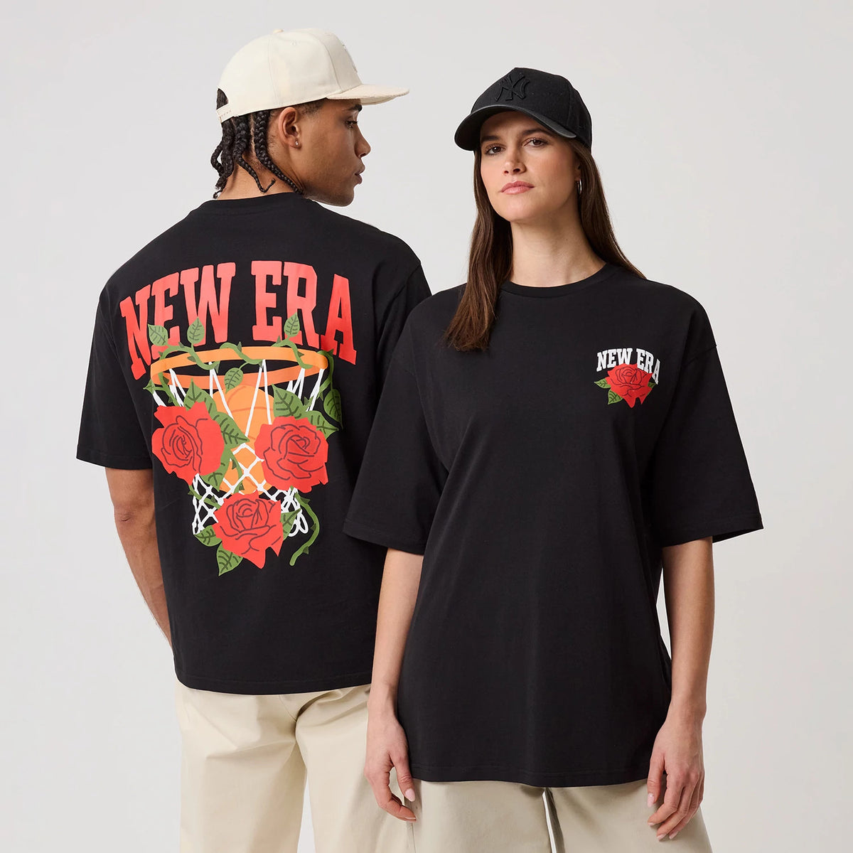 The model is wearing this New Era Floral Graphic T-Shirt in black. 1