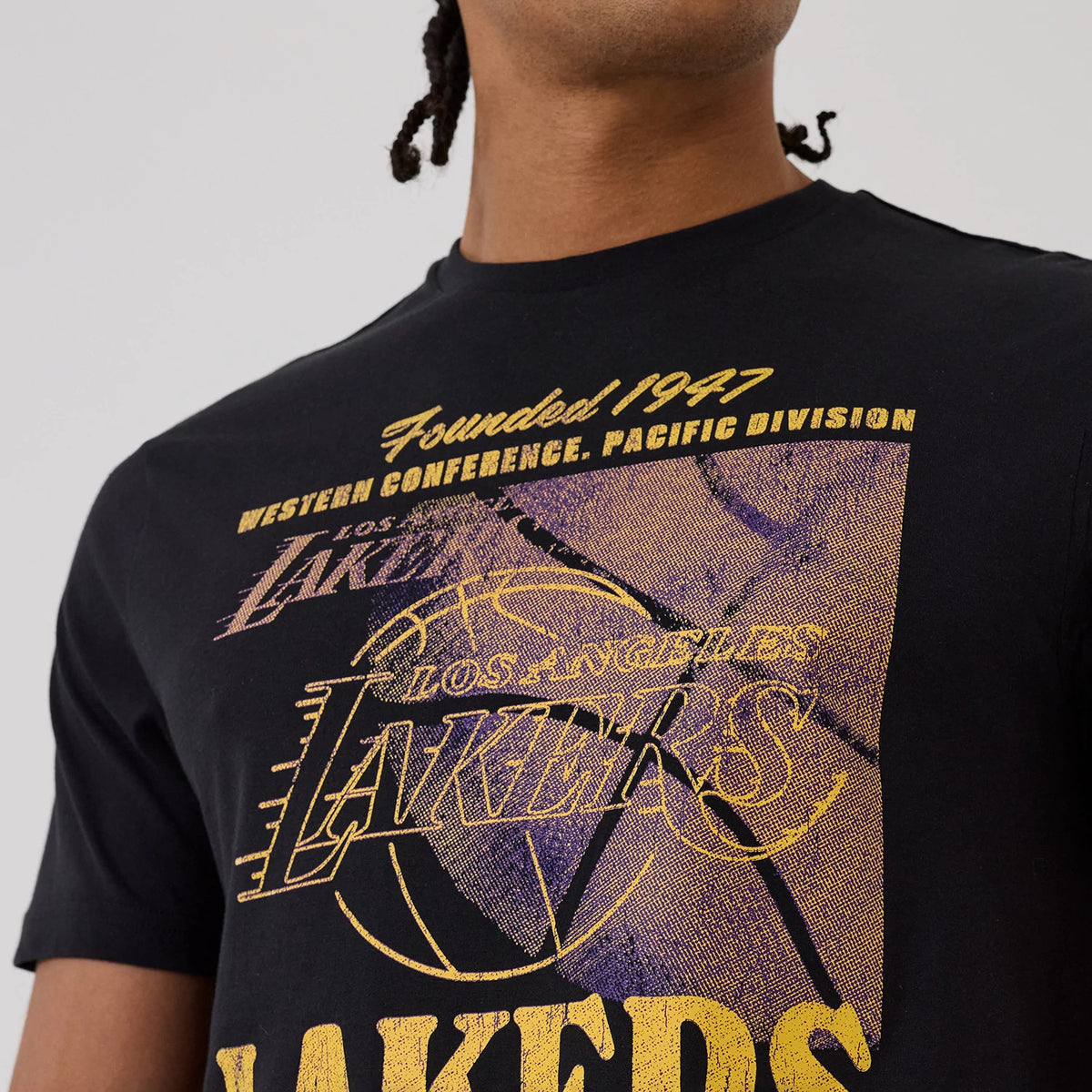 The model is wearing this NBA Graphic LA Lakers T-Shirt in black. 4