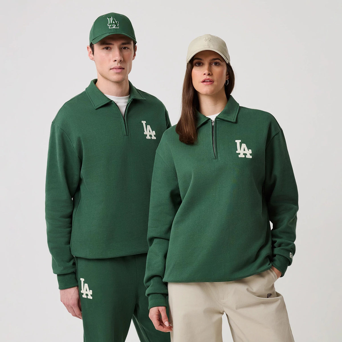 The model is wearing this MLB LA Dodgers 1/4 Zip Sweater in dark green. 1