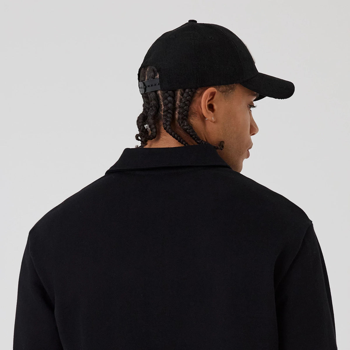 The model is wearing this MLB New York Yankees 1/4 Zip Sweater in black. 5
